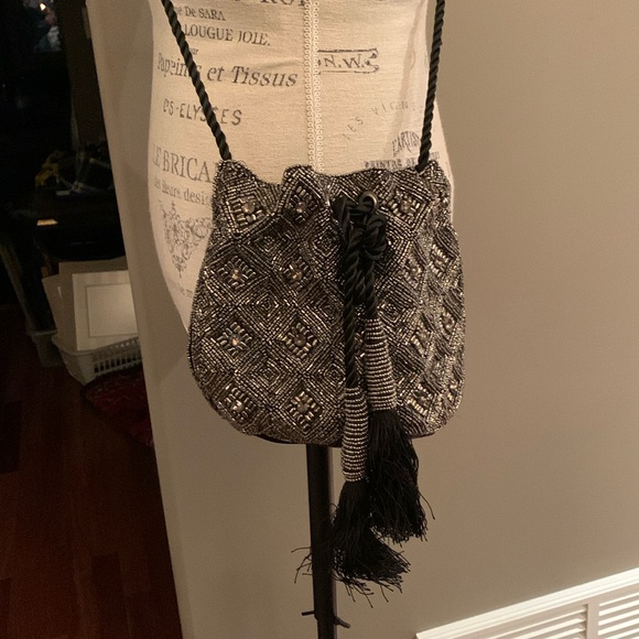 Beaded and jeweled bag with ties Long strap/cord.
Great bag Very decorative - Picture 1 of 6